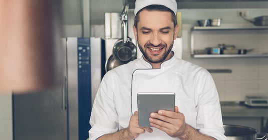 Man restaurant chef working in the kitchen