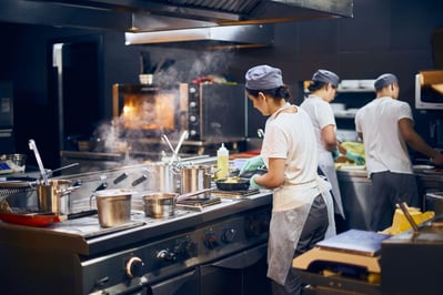 Woman cook at work in a modern kitchen