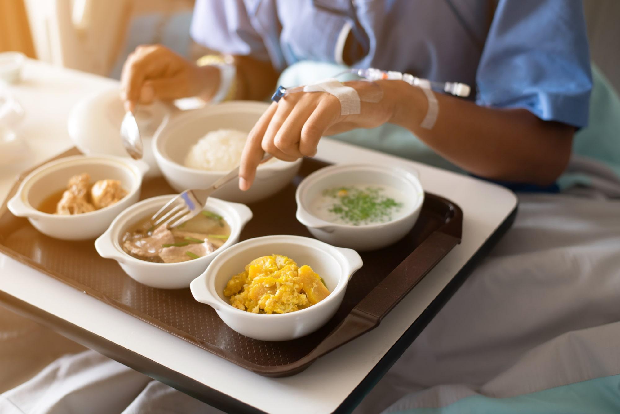 woman in hospital eating food